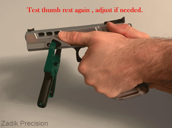 Test thumb rest position on firearm.